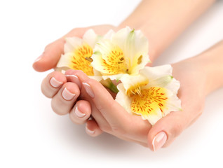 Obraz na płótnie Canvas Woman hands with beautiful manicure and white lily isolated on white background