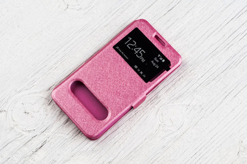 Pink plastic case for smart phone on white background