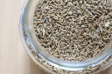 Glass jar with aniseed grains
