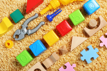 Colorful kids toys on carpet