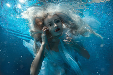Portrait of a woman under water.