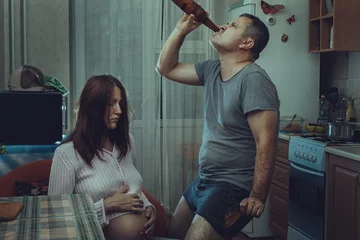 Foto op Plexiglas Sad wife, husband is an alcoholic. © Petro