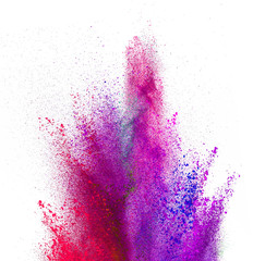 Explosion of colored powder on white background