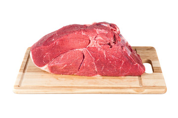 Portion of raw Beef Fillet on wooden Board. isolated on white background