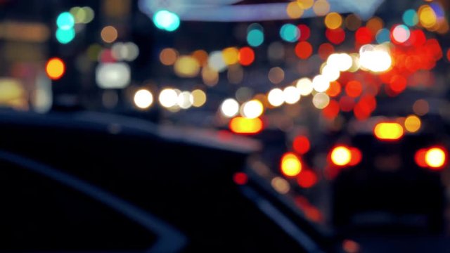Defocused colourful footage of congested street on Manhattan NYC at night