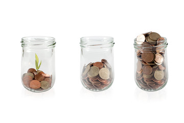 Coins in Glass Jar on White Background