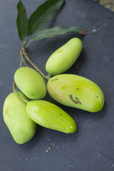 green fresh mango on black