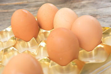Group of fresh eggs in a  tray.