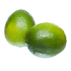 two ripe lime on white background