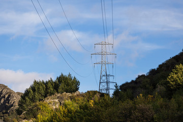 high voltage tower on hill