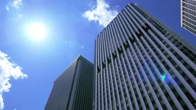 Towering skyscrapers against blue sunny sky in Lower Manhattan