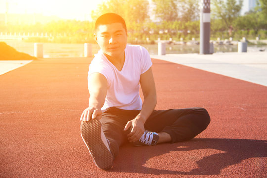 Young Asian Man Doing Stretching