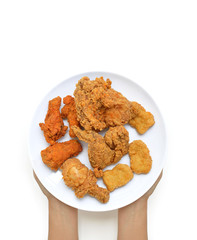 Hands holding  Fried Chicken on a White Background.