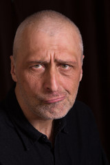 Portrait of displeased men