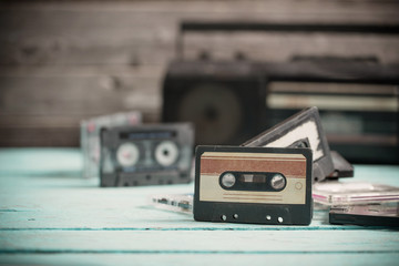 old cassette tape and player on the wood background