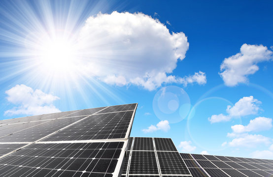 Solar panels against sunny sky. Clean energy.