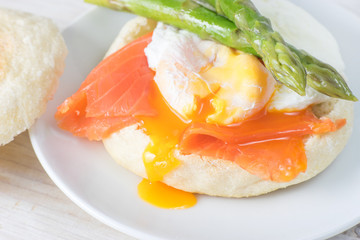 Close up of English muffin with poached egg