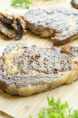 beefsteak on wood plate