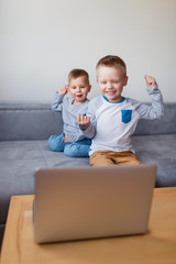 Shot of children communicate with their grandparents online
