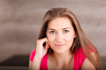 Portrait of a beautiful young smiling woman.