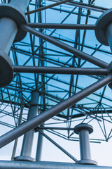 Bottom view of modern glass roof in business district in evening