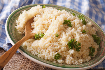 Bulgur with parsley close-up on a plate. horizontal
