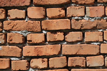 Weathered texture of stained old red brick wall background