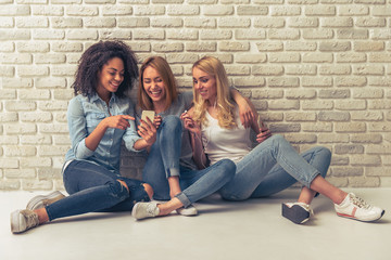 Beautiful girls with gadgets