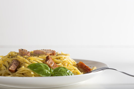 Spaghetti carbonara on white plate