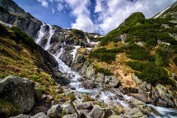 Fototapeta na wymiar Mountain waterfall Siklawa in Polish Tatra