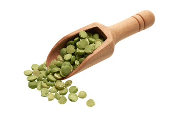 Dried green peas in a wooden scoop