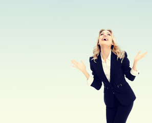 Happy gesturing young cheerful businesswoman