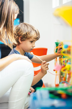 Side View Of Boy Playing Xylophone