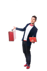 Portrait of Businessman sitting on his suitcase while and smile