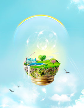 Green concpet : energy, eco bulb conception with fantasy blue sky, beautiful clouds and rainbow