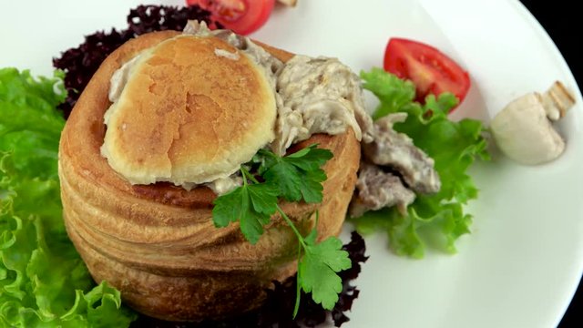 Delicious Vol au vent filled with meat and mushrooms, French restaurant food