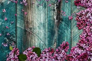 Lilac flowers on wooden board