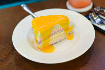 Orange rainbow crape cake