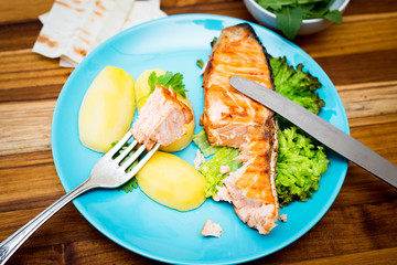 Grilled salmon on wooden background