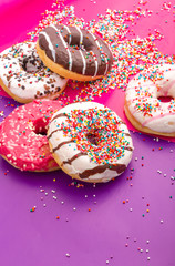 Donuts on color background.