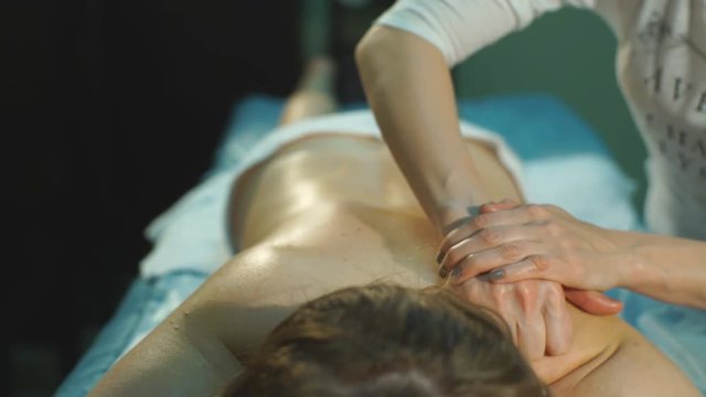 a woman doing therapeutic massage