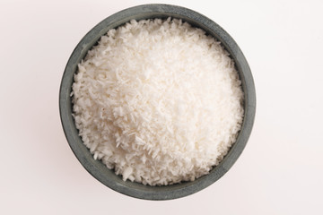Coconut flakes in ceramic bowl