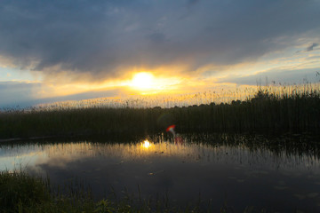 Beautiful sunset over calm lake