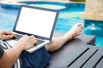 Screen mockup of laptop that a man is using in the pool on vacation - work anywhere and internet...