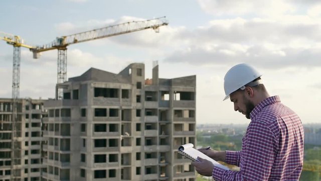 engineer looking on project on construction site
