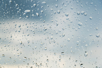 water drops on glass, sky background