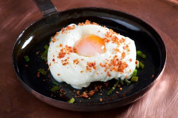 Fine dining, Green asparagus with poached egg in a frying pan