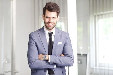 Fototapeta premium Happy young businessman