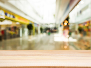 Wooden empty table in front of blurred background