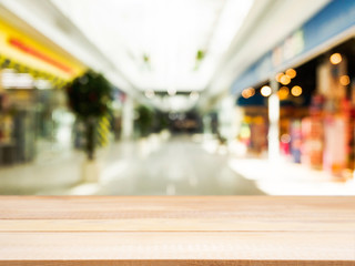 Wooden empty table in front of blurred background
